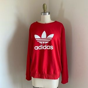 Red adidas crewneck.